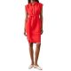 A woman wearing a red/orange shirtdress and off-white flats