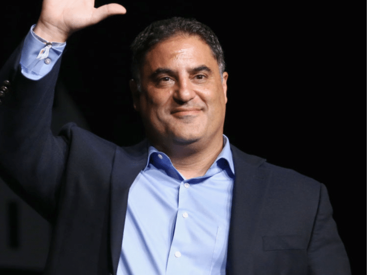 Cenk Uygur waves at a crowd. He was interviewed on LBC with Shelagh Fogarty on 3 June 2026