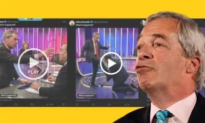 Nigel Farage in front of deepfakes of himself