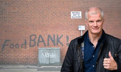 Al Carns in front of a food bank