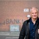 Al Carns in front of a food bank