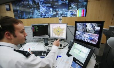 A police officer in front of computers, AI use