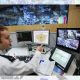 A police officer in front of computers, AI use