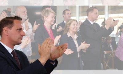 Mike Tapp clapping in front of Yvette Cooper, Labour