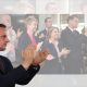 Mike Tapp clapping in front of Yvette Cooper, Labour