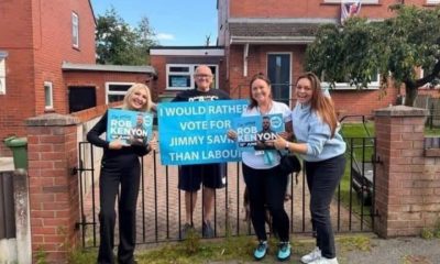 Reform councillors standing next to a man holding a sign which reads 'I would rather vote for Jimmy Saville than Labour'