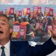 Nigel Farage in front of the offending image - Reform UK