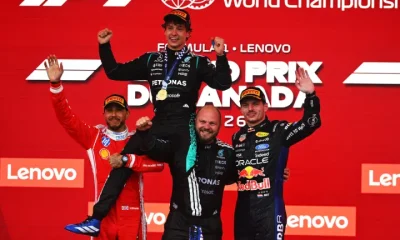 MONTREAL, QUEBEC - MAY 24: Race winner Andrea Kimi Antonelli of Italy and Mercedes AMG Petronas F1 Team Second placed Lewis Hamilton of Great Britain and Scuderia Ferrari Third placed Max Verstappen of the Netherlands and Oracle Red Bull Racing and Dean Hale, Senior Race Team Composite Technician at Mercedes AMG Petronas F1 Team on the podium during the F1 Grand Prix of Canada at Circuit Gilles-Villeneuve on May 24, 2026 in Montreal, Quebec. (Photo by Rudy Carezzevoli/Getty Images) Formula 1