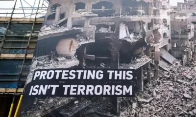 Huge banner shows destruction in Gaza and says: Protesting This Isn't Terrorism Palestine Action