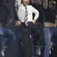 GettyImages-2265108901 Harry Styles Sparks Concern After Viral Video Shows Singer Choking on Water Collapsing on Stage