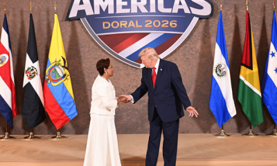 U.S. President Donald Trump greets Kamla Persad-Bissessar, SC, MP, Prime Minister of the Republic of Trinidad and Tobago, as he hosts “The Shield of the Americas Summit ,“ a gathering with heads of state and government officials from 12 countries in the Americas at the Trump National Doral Golf Club on March 7, 2026 in Doral, Florida. The White House describes the gathering as a landmark summit aimed at reshaping regional alliances and reinforcing U.S. influence in the Western Hemisphere.