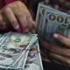 Dollar climbs to two-month peak as Fed hike bets ramp up