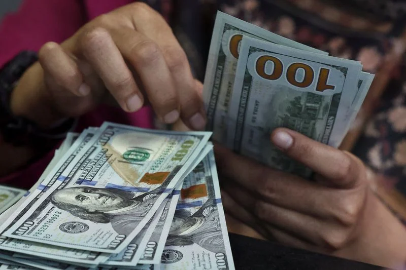 Dollar climbs to two-month peak as Fed hike bets ramp up