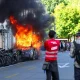 Protesters smash windows and set Tesla ablaze in anti-G7 march in Geneva