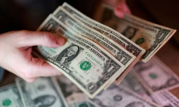 Dollar hits 13-month high as rate-hike bets, stock rout boost demand