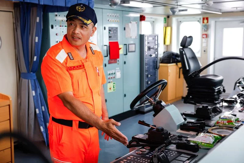 Facing China, one Taiwan Coast Guard officer draws strength from the gods