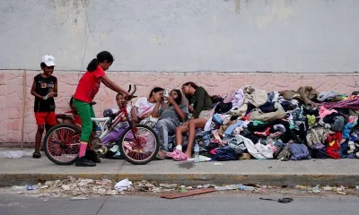 Families of Venezuelans deported from the US and lost in hotel collapse search for loved ones, and for answers