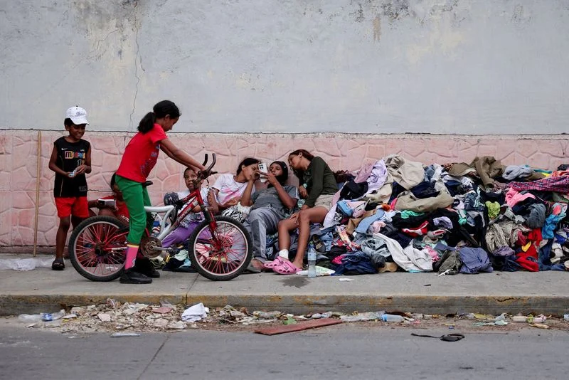 Families of Venezuelans deported from the US and lost in hotel collapse search for loved ones, and for answers