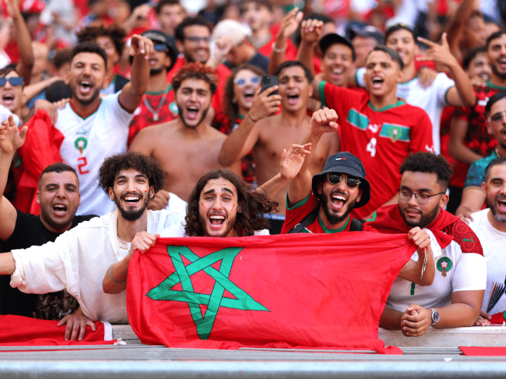 Fans of Team Morocco, some holding flags and others wearing face paint, cheer prior to the Men's semifinal match between Morocco and Spain during the Olympic Games Paris 2024 at Stade de Marseille on August 05, 2024 in Marseille, France.