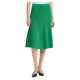 A woman wearing a bright green skirt and black slingbacks