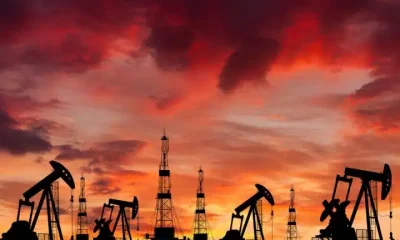 Oil field at sunset, illustrating fossil fuel financing