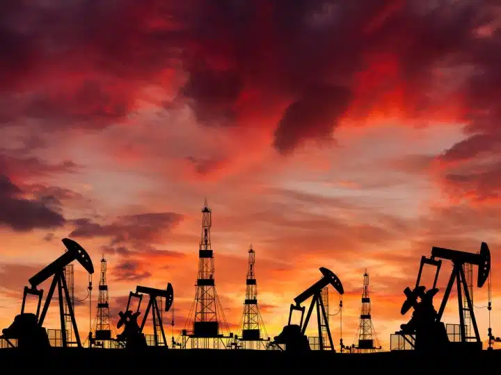 Oil field at sunset, illustrating fossil fuel financing