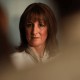 Rachel Reeves looks into the distance looking confident with a shadowy, blurred effect around the edges of the photo