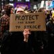 Home made placard saying: Protect The Right To Strike Strike days plummet