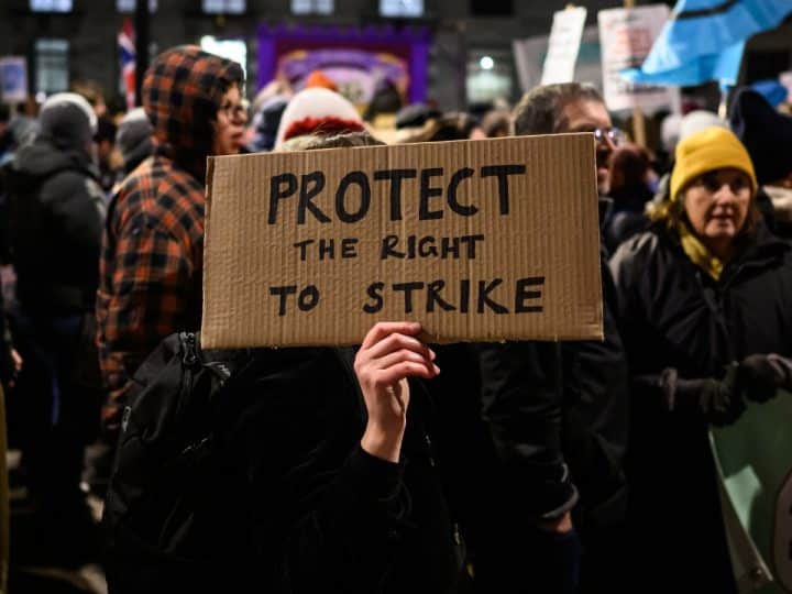 Home made placard saying: Protect The Right To Strike Strike days plummet