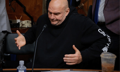 Senate Homeland Security and Governmental Affairs Committee member Senator John Fetterman shrugs after voting for Senator Markwayne Mullin to be Secretary of the Department of Homeland Security at the Dirksen Senate Office Building on Capitol Hill on 19 March 2026 in Washington, DC in the US