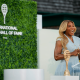 Serena Williams, looking glam in a smart tennis dress, introduces Maria Sharapova during the 2025 Induction Celebration weekend at the International Tennis Hall of Fame in Newport, R.I. on Saturday, August 23, 2025.