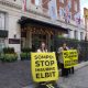 Protesters against Sompo Insurance hold banners saying: Sompo: Stop Insuring Elbit and No New Workers For Genocide Insurers