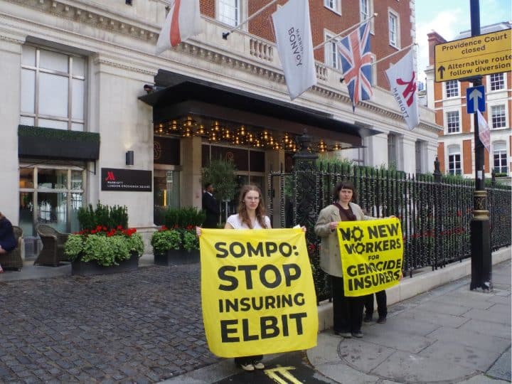 Protesters against Sompo Insurance hold banners saying: Sompo: Stop Insuring Elbit and No New Workers For Genocide Insurers