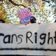 Trans rights activists hold placard