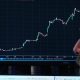 Wall St ends higher as SpaceX's market debut dominates