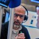 Wall St ends mixed as chip sell-off weighs on Nasdaq