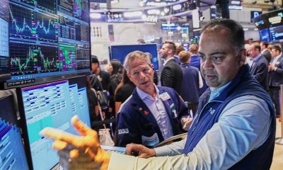 Wall Street ends mixed as investors focus on Iran talks
