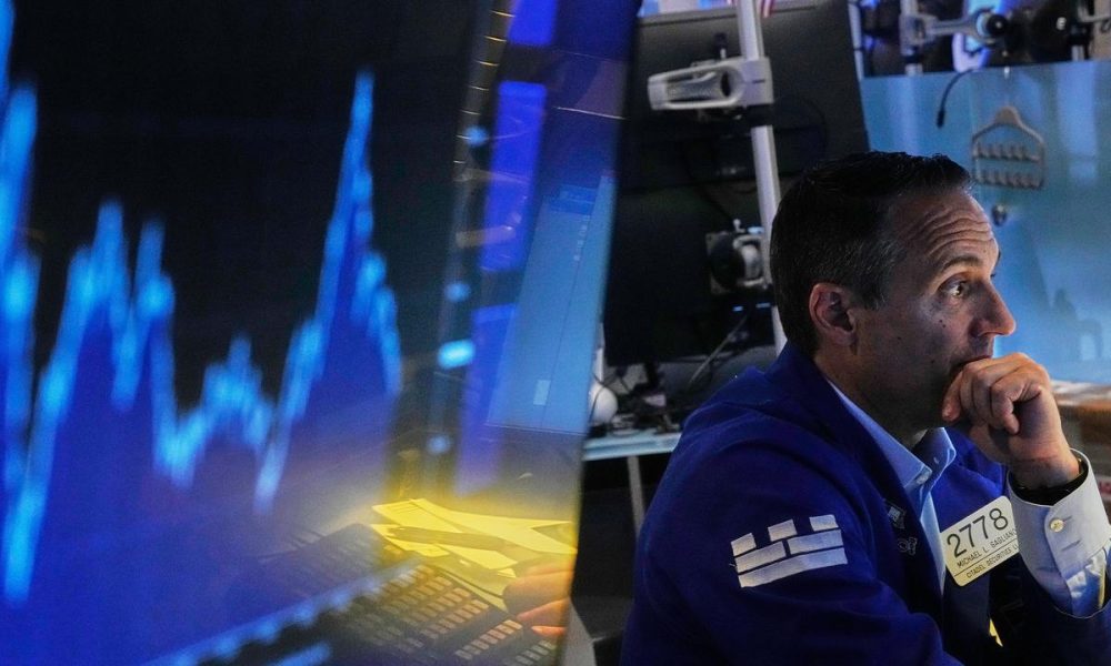 Wall Street ends lower as shares of chip firms tumble