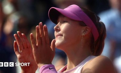 Mirra Andreeva celebrates by clapping her hands together close to ger face