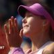 Mirra Andreeva celebrates by clapping her hands together close to ger face