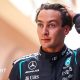 George Russell runs his hand through his hair and looks disappointed following Monaco Grand Prix qualifying