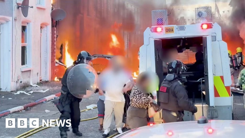 Residents flee as cars and houses burn in Belfast
