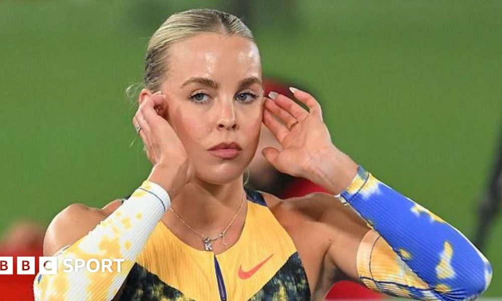 Keely Hodgkinson poses on a throne after breaking the world indoor 800m record