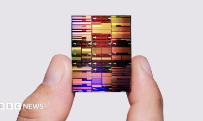 Researcher holding IBM's sub-1 nm node chip