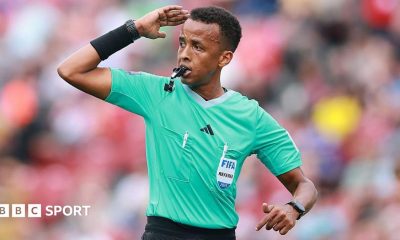 Omar Artan signalling for play to continue