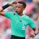 Omar Artan signalling for play to continue