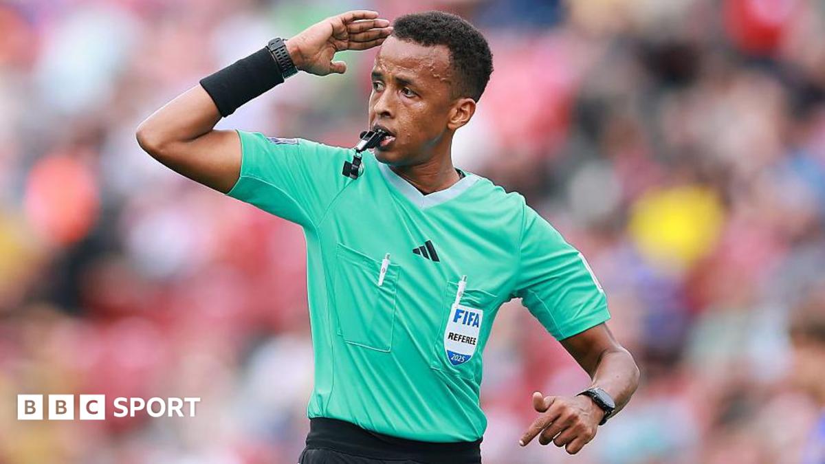 Omar Artan signalling for play to continue