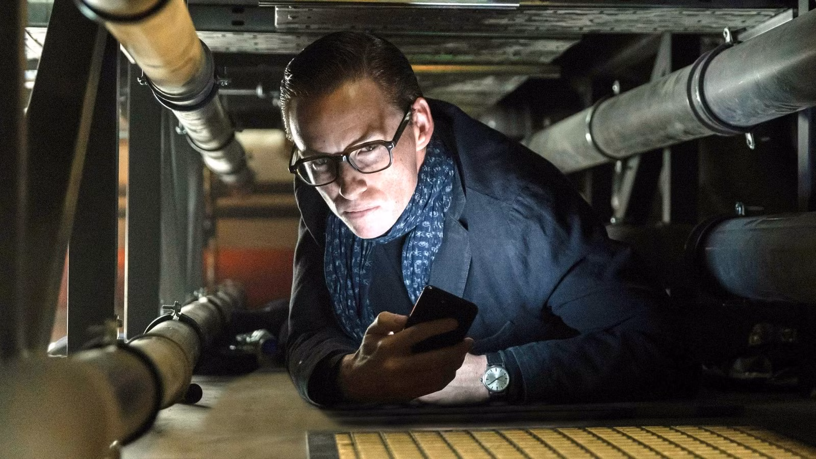 Eddie Redmayne it a crawlspace in The Day of the Jackal