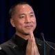 Chinese billionaire Guo Wengui places his hands together while speaking on stage during a news conference in 2018 in New York