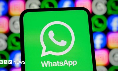 WhatsApp logo displayed on a smartphone screen, with its logo shown alongside those of Meta apps Facebook, Instagram and Threads.